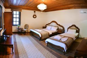 Postel nebo postele na pokoji v ubytování Uluhan Hotel