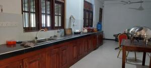 a kitchen with a sink and a counter top at Yaya Estate in Radampola