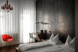 Postel nebo postele na pokoji v ubytování Boutique Hotel Imperialart