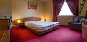 Posteľ alebo postele v izbe v ubytovaní Hotel West