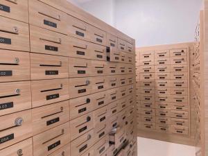 a wall of drawers in a room at Vinhome Green Bay Căn Hộ Chung Cư Cao Cấp in Hanoi