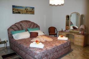 Un ou plusieurs lits dans un hébergement de l'établissement Palazzo Scavone