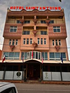 a hotel entrance with a sign on top of it at Hotel Saint Antoine in Tafraoute