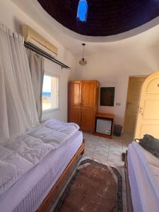 Letto o letti in una camera di Dahab Lodge