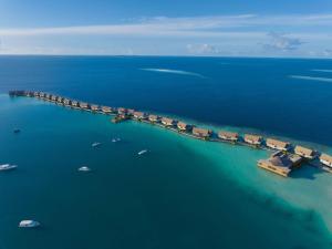 an aerial view of a dock in the water at Waldorf Astoria Maldives Ithaafushi in South Male Atoll