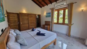 Postel nebo postele na pokoji v ubytování Sunny Villa
