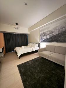 Ένα ή περισσότερα κρεβάτια σε δωμάτιο στο 81 Newport Blvd Cluster 4 Unit B 3rd flr by Rechelle Nunag