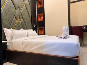 Postel nebo postele na pokoji v ubytování Hotel Sky Suite-Sahar Cargo And Intl Airport