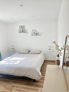Ένα ή περισσότερα κρεβάτια σε δωμάτιο στο Bel appartement dans hameau calme