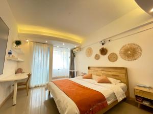 Łóżko lub łóżka w pokoju w obiekcie Xihe Light Luxury Self-service Apartment