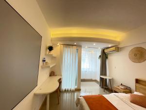 Łóżko lub łóżka w pokoju w obiekcie Xihe Light Luxury Self-service Apartment