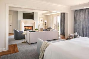 a hotel room with a couch and a fireplace at Waldorf Astoria Monarch Beach Resort & Club in Dana Point +80 photos