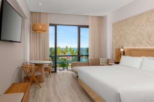 Postel nebo postele na pokoji v ubytování Hilton Tulum Riviera Maya All-Inclusive Resort