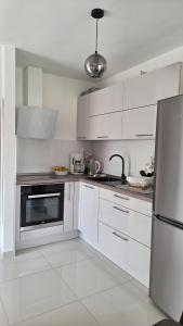 Kuchyň nebo kuchyňský kout v ubytování Apartmani I & J Šerić