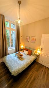 Postel nebo postele na pokoji v ubytování Le vintage RDC