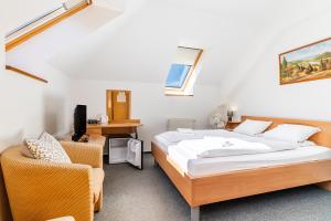 Voodi või voodid majutusasutuse Garni Hotel Gavurky toas