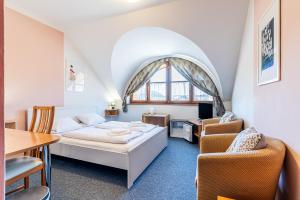 Voodi või voodid majutusasutuse Garni Hotel Gavurky toas