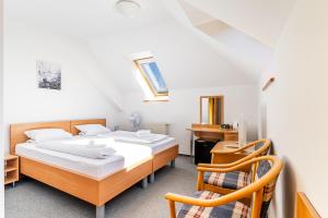 Voodi või voodid majutusasutuse Garni Hotel Gavurky toas