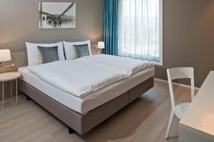 Giường trong phòng chung tại Hotel Kettenbrücke