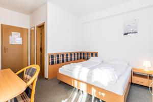 Voodi või voodid majutusasutuse Garni Hotel Gavurky toas