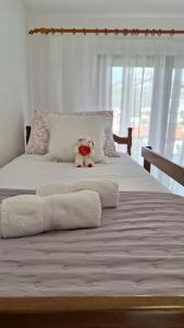 Postel nebo postele na pokoji v ubytování Apartmani I & J Šerić