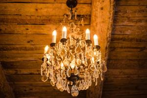 a chandelier hanging from the ceiling of a building at Le Hameau Des Pesquiers Ecolodge & Spa, Curio Collection By Hilton in Hyères