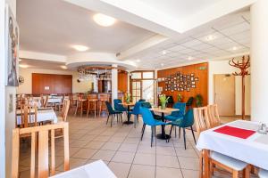 Restoran või mõni muu söögikoht majutusasutuses Garni Hotel Gavurky