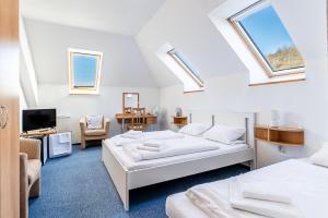Voodi või voodid majutusasutuse Garni Hotel Gavurky toas