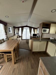 a kitchen and living room of a recreational vehicle at Waterfront Kent coast in Rochester +11 photos