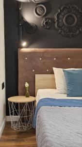 Posteľ alebo postele v izbe v ubytovaní Black Room Apartment