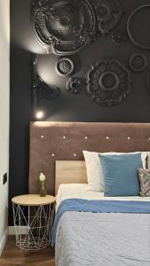 Posteľ alebo postele v izbe v ubytovaní Black Room Apartment