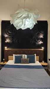 Posteľ alebo postele v izbe v ubytovaní Black Room Apartment