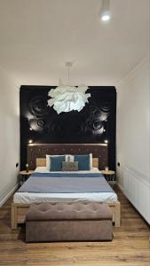 Posteľ alebo postele v izbe v ubytovaní Black Room Apartment