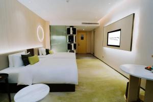Postelja oz. postelje v sobi nastanitve Wuhan Hazens Hotel