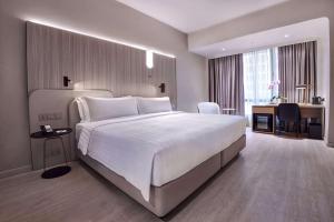 Postelja oz. postelje v sobi nastanitve Wyndham Singapore Hotel