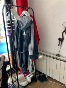 a rack with clothes hanging on a radiator at Le Verdier in Chauffailles
