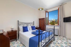 Postel nebo postele na pokoji v ubytování Relais Santa Lucia + 13 fotografií