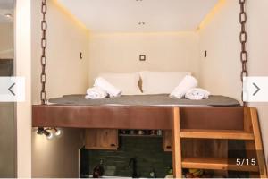 a bed hanging from the ceiling in a room at BELLA CASA del NONNO in Corfu Town