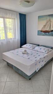Postel nebo postele na pokoji v ubytování Apartmani I & J Šerić