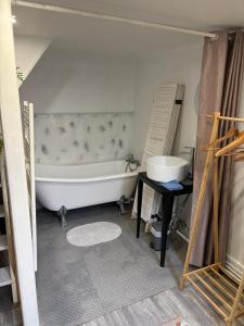 a bathroom being remodeled with a tub and a sink at Dieppe Coeur de Ville in Dieppe