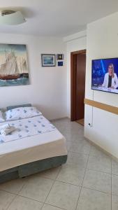 Postel nebo postele na pokoji v ubytování Apartmani I & J Šerić