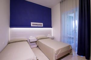 Voodi või voodid majutusasutuse Gattarella Family Resort Puglia - Standard Half-Board à buffet toas