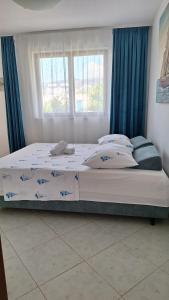 Postel nebo postele na pokoji v ubytování Apartmani I & J Šerić