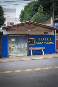 a hotel casa nostra on the side of a street at Hotel Pousada Casa Nostra in Erechim