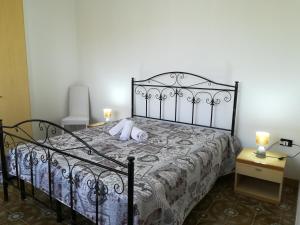 a bedroom with a bed with two pillows on it at Villa Maddalena a Otranto in Otranto