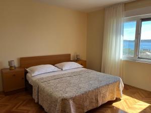 Postel nebo postele na pokoji v ubytování Apartments Zulim