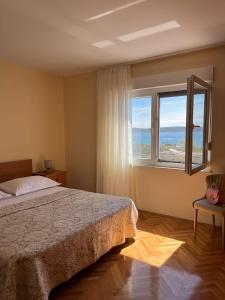 Postel nebo postele na pokoji v ubytování Apartments Zulim