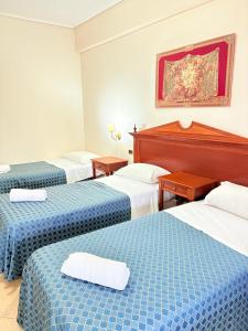 Postel nebo postele na pokoji v ubytování D'Angelo Palace Hotel