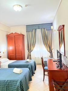 Postel nebo postele na pokoji v ubytování D'Angelo Palace Hotel