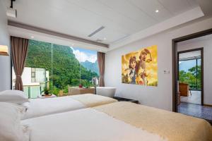 Łóżko lub łóżka w pokoju w obiekcie Kite Home Stay